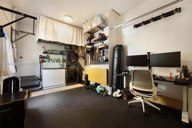 a room with gym equipment and a flat screen tv