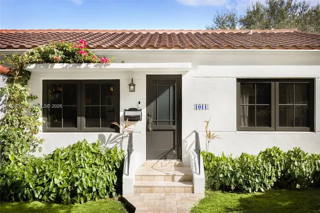 front view of a house with a yard