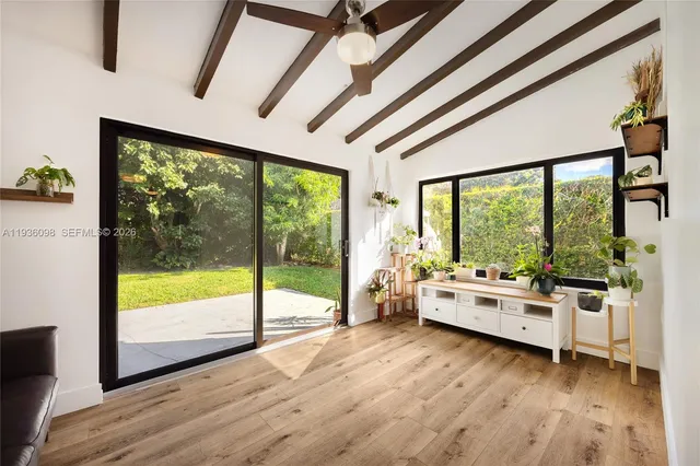 a room with furniture and wooden floor