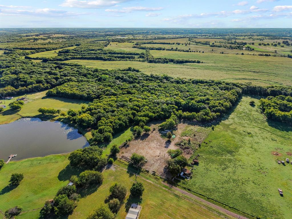 8194 Private Road 5406 Blue Ridge, TX 75424 - Photo 3 of 8 a view of a lake with a yard