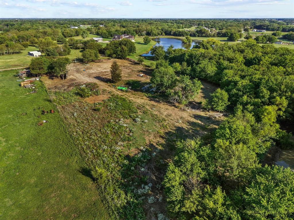 8194 Private Road 5406 Blue Ridge, TX 75424 - Photo 7 of 8 an aerial view of residential houses with outdoor space and trees