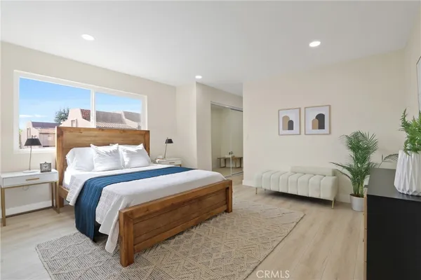 a bedroom with a bed and a couch