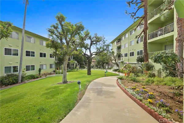 a view of a building with a yard
