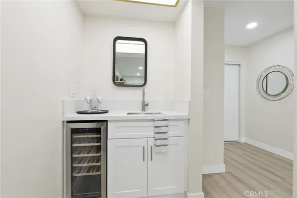 a bathroom with a sink a vanity and a mirror