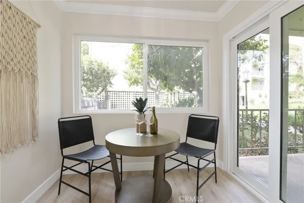 a dining room with furniture window and outside view