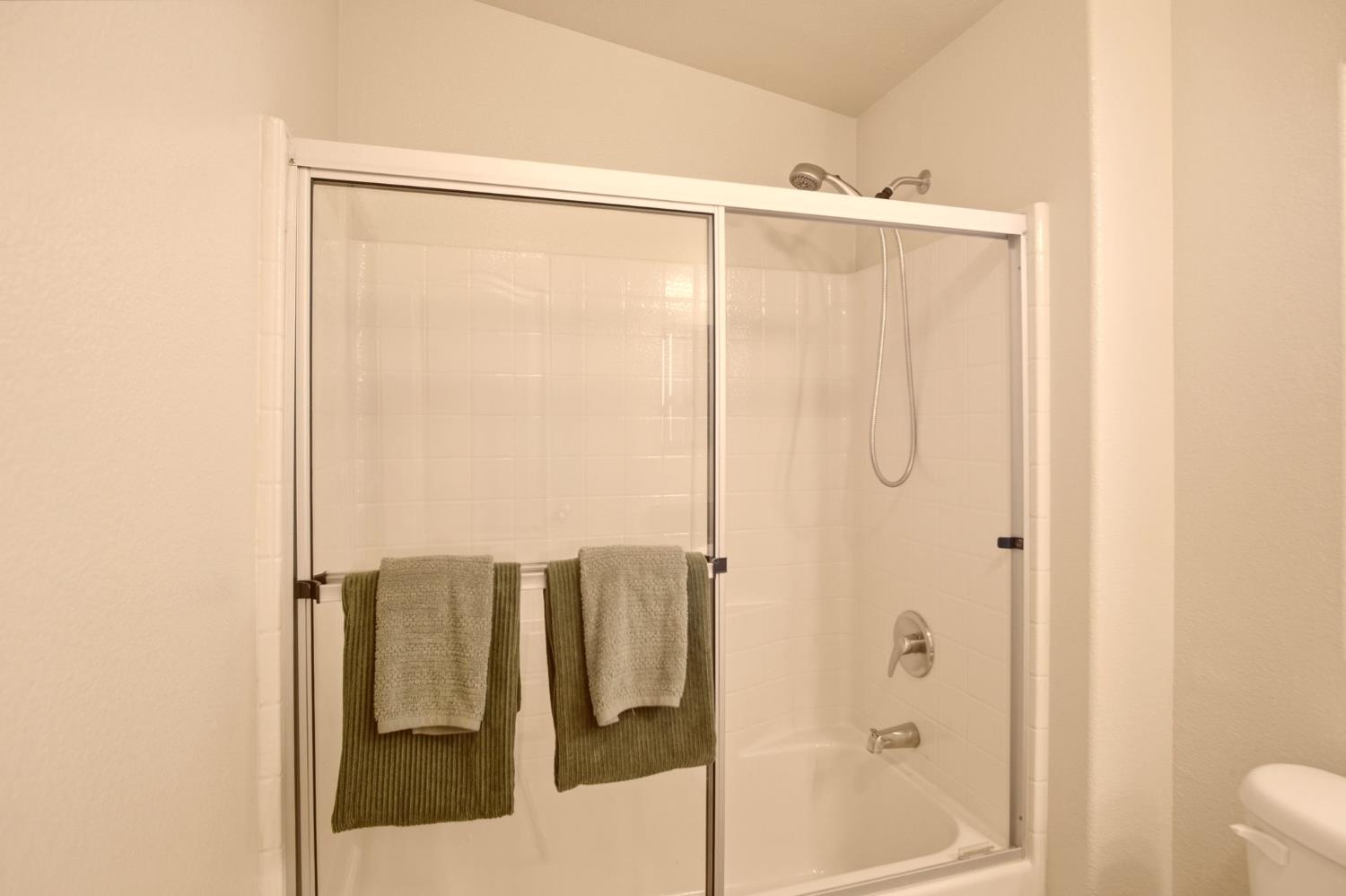 145 Dory Lane Modesto, CA 95356 - Photo 14 of 27 a bathroom with a shower and a sink