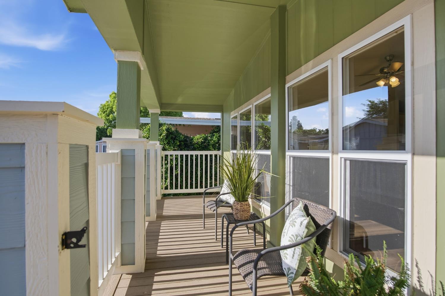 145 Dory Lane Modesto, CA 95356 - Photo 3 of 27 a view of a chair and table in the balcony