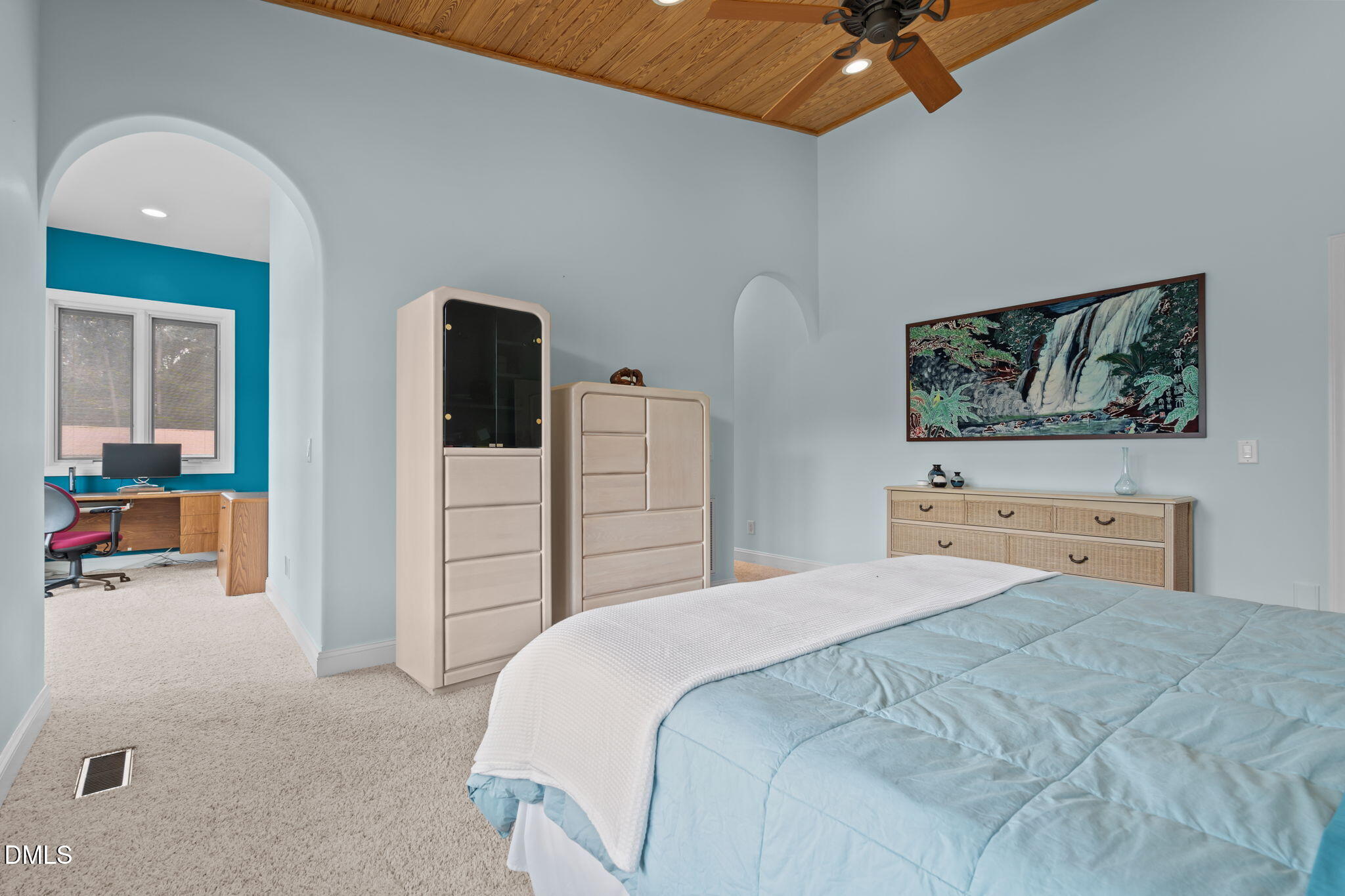 287 Herbie Road Carthage, NC 28327 - Photo 34 of 53 a bedroom with a bed and a chandelier