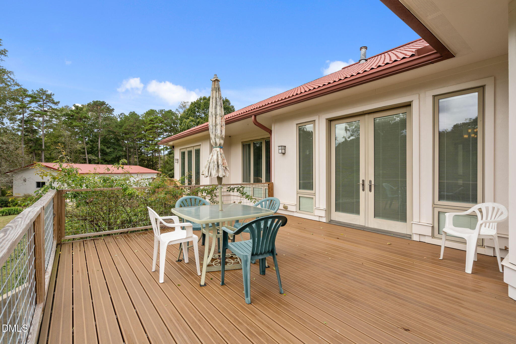 287 Herbie Road Carthage, NC 28327 - Photo 45 of 53 a patio with wooden floor table and chairs