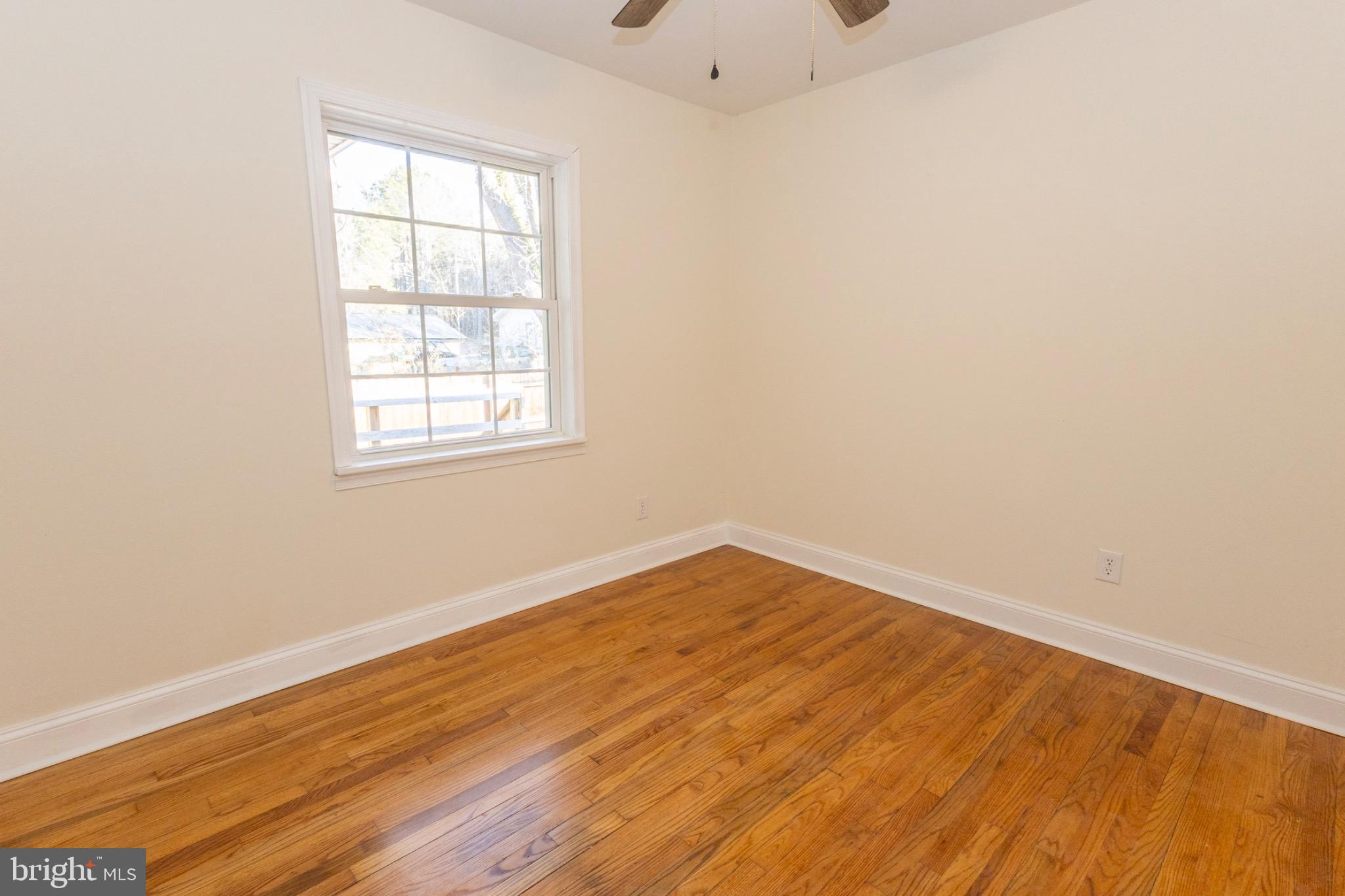 49151 Wynne Road Ridge, MD 20680 - Photo 34 of 80 Bright and airy bedroom with hardwood floors.