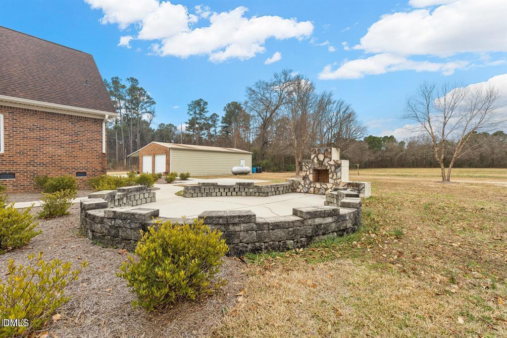 2751 Buie - Philadelphus Road Pembroke, NC 28372 - Photo 23 of 30 a view of a fountain in front of a house