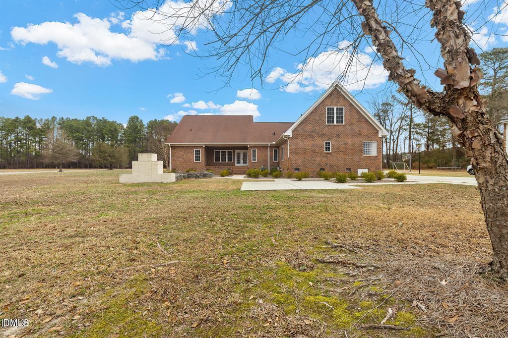 2751 Buie - Philadelphus Road Pembroke, NC 28372 - Photo 24 of 30 a view of a house with a yard