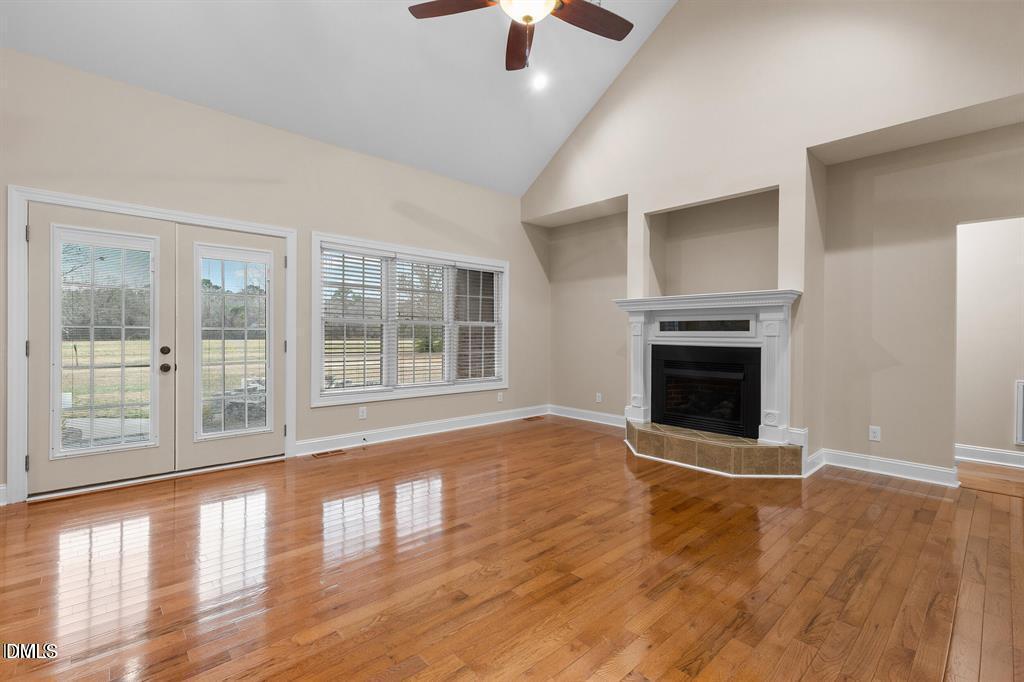 2751 Buie - Philadelphus Road Pembroke, NC 28372 - Photo 3 of 30 a view of empty room with wooden floor and fireplace