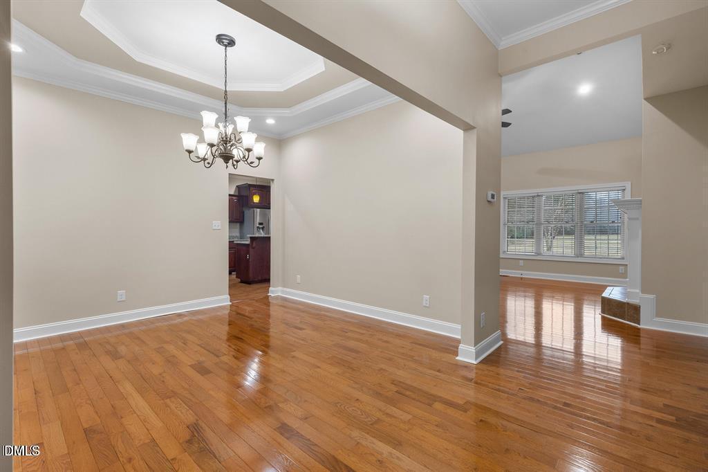 2751 Buie - Philadelphus Road Pembroke, NC 28372 - Photo 4 of 30 a view of an empty room with wooden floor and a window