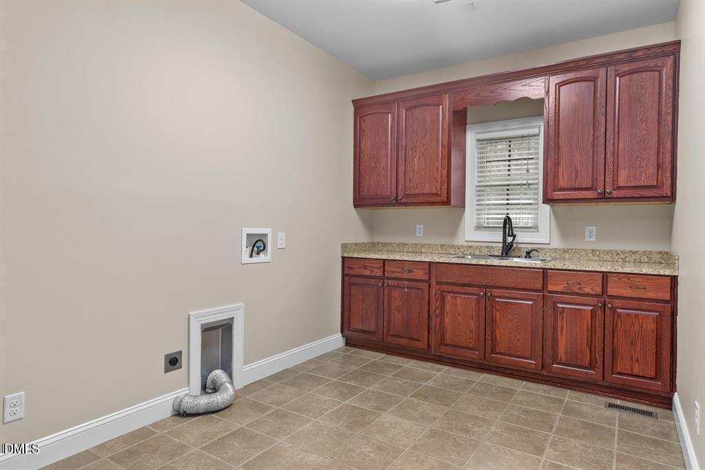 2751 Buie - Philadelphus Road Pembroke, NC 28372 - Photo 5 of 30 a kitchen with granite countertop a sink cabinets and granite counter tops
