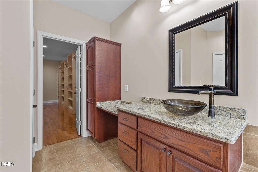 2751 Buie - Philadelphus Road Pembroke, NC 28372 - Photo 9 of 30 a bathroom with a granite countertop sink and a mirror