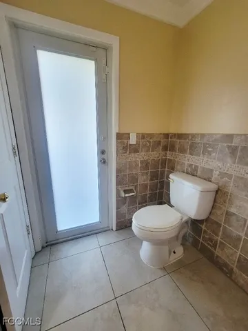 a bathroom with a toilet and a sink
