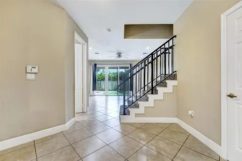 a view of an entryway with wooden floor
