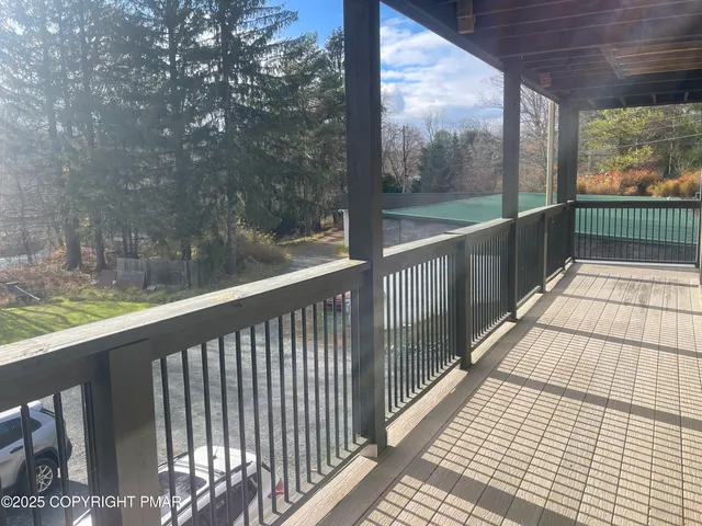 a view of balcony with wooden floor