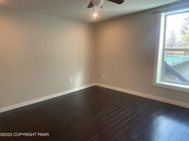 a bathroom with a shower and toilet