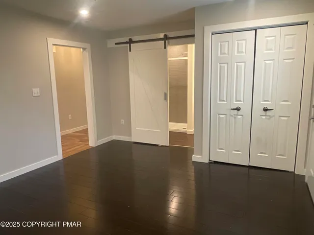 a bathroom with a sink a toilet a mirror and vanity