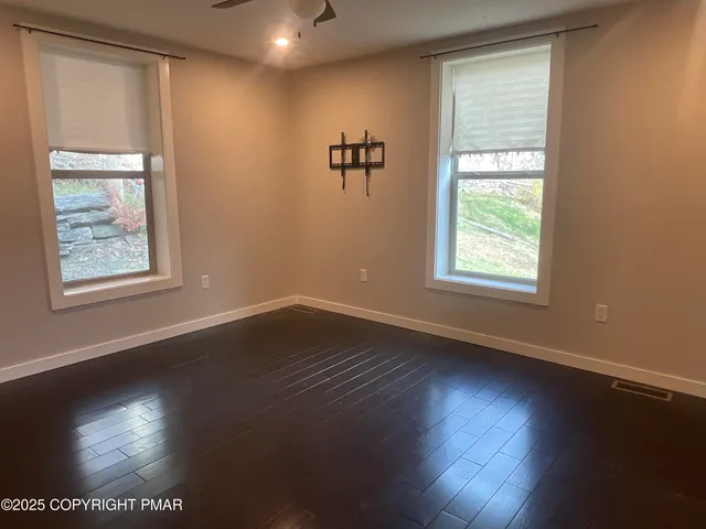 a bathroom with a double vanity sink toilet and shower