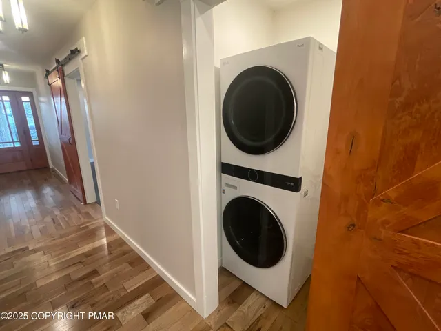 a view of a yard with wooden fence