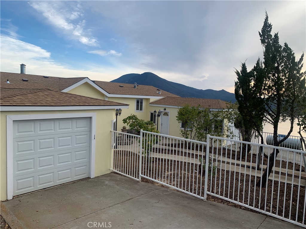 7701 Al Drive Lucerne, CA 95458 - Photo 1 of 1 a view of a house with a iron gate