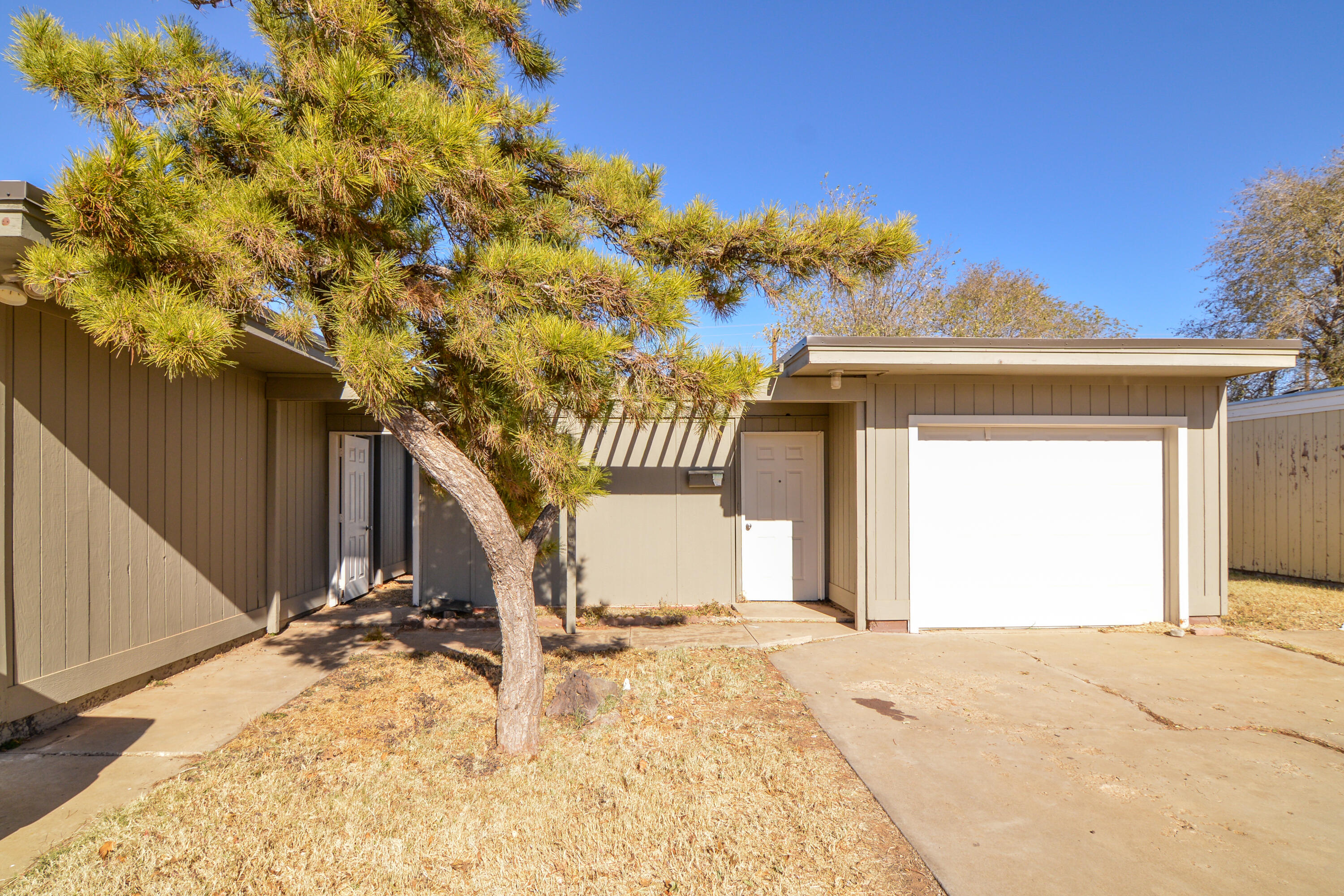 3714 53rd Street, Unit A & B Lubbock, TX 79413 - Photo 2 of 28 a view of a house with a yard