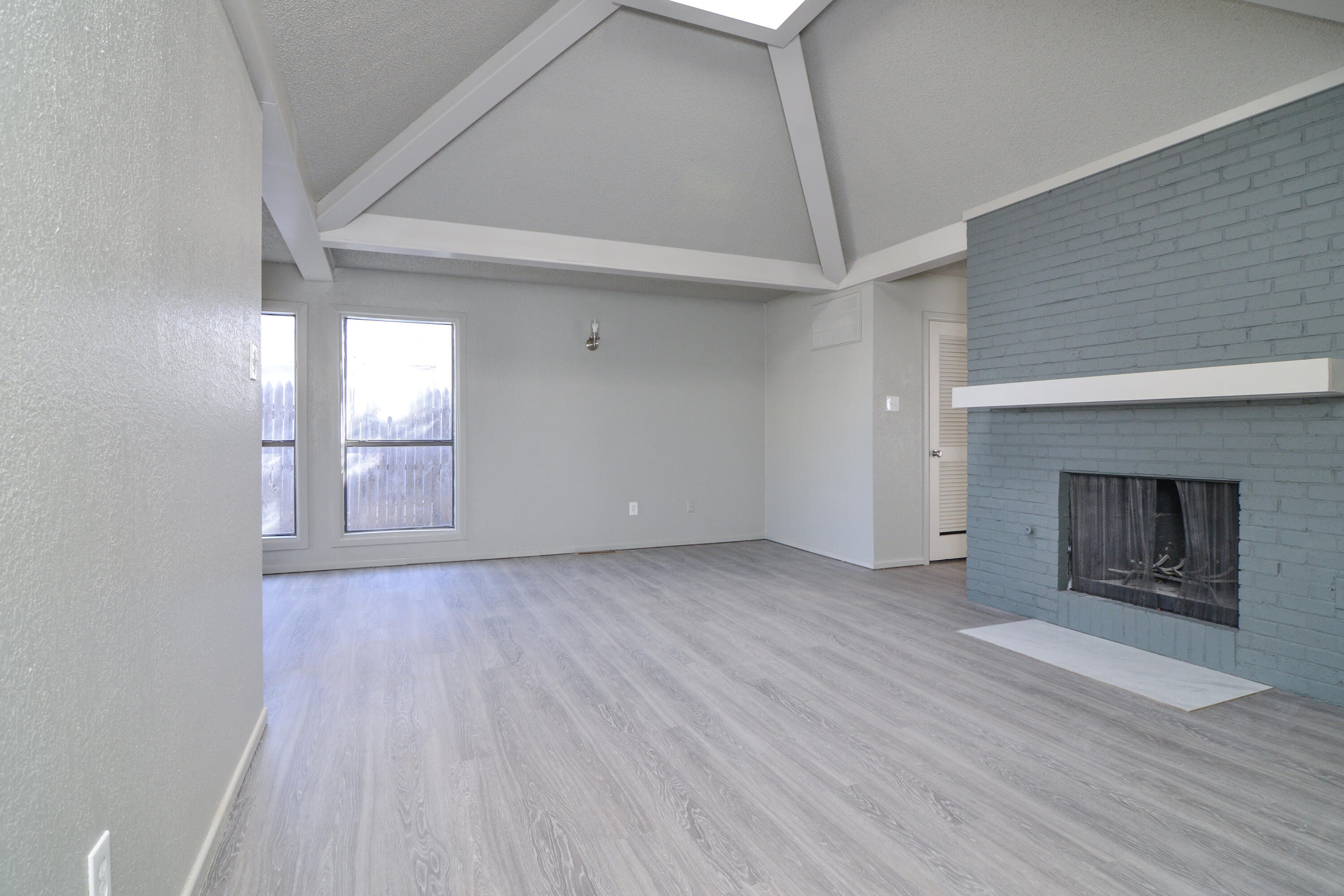 3714 53rd Street, Unit A & B Lubbock, TX 79413 - Photo 7 of 28 a view of empty room with wooden floor and fireplace