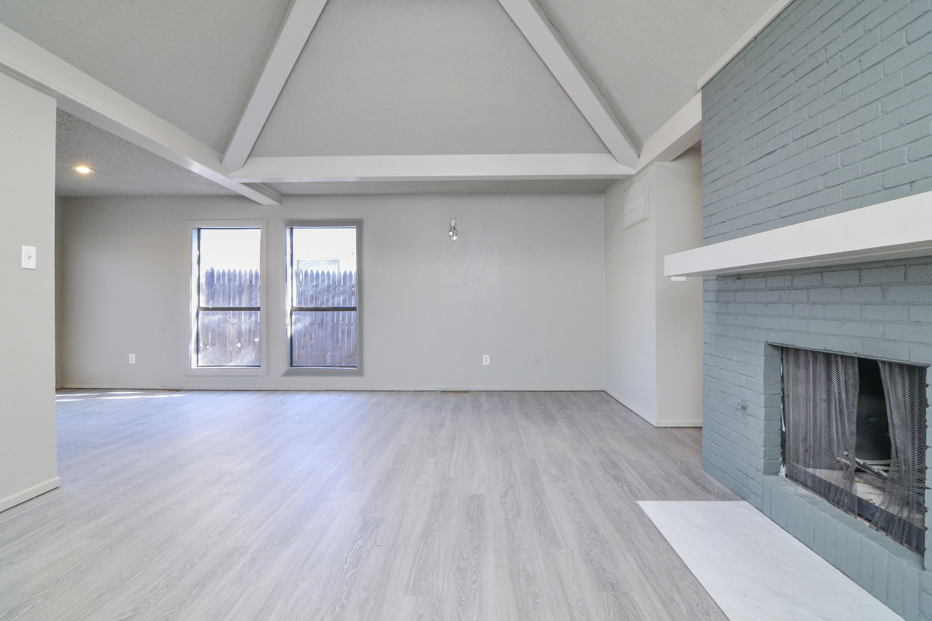 3714 53rd Street, Unit A & B Lubbock, TX 79413 - Photo 8 of 28 an empty room with windows and fireplace