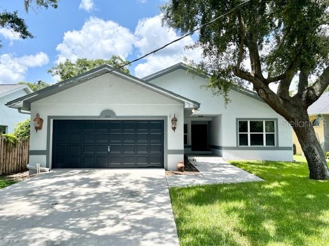 405 Arlington Avenue East Oldsmar, FL 34677 - Photo 2 of 21 a house that has a tree in front of the house