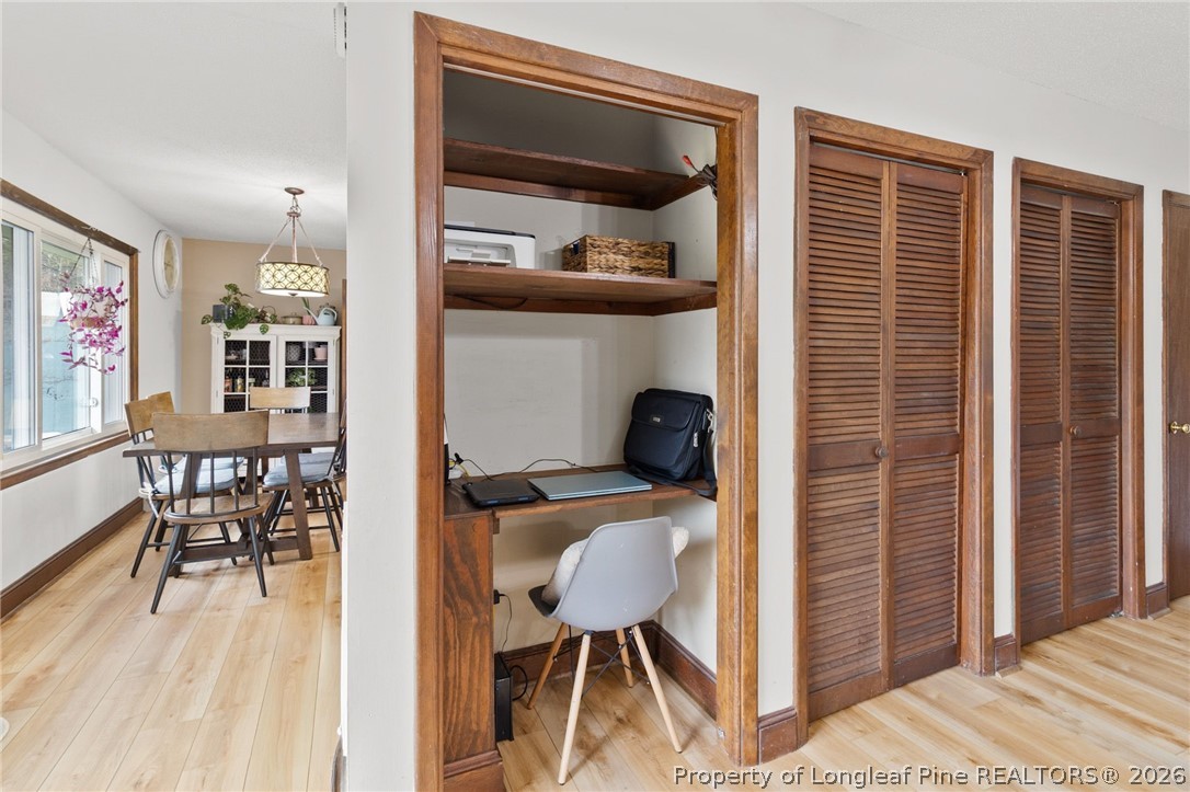 730 Slocomb Road Fayetteville, NC 28311 - Photo 12 of 48 a view of a workspace with furniture and a window