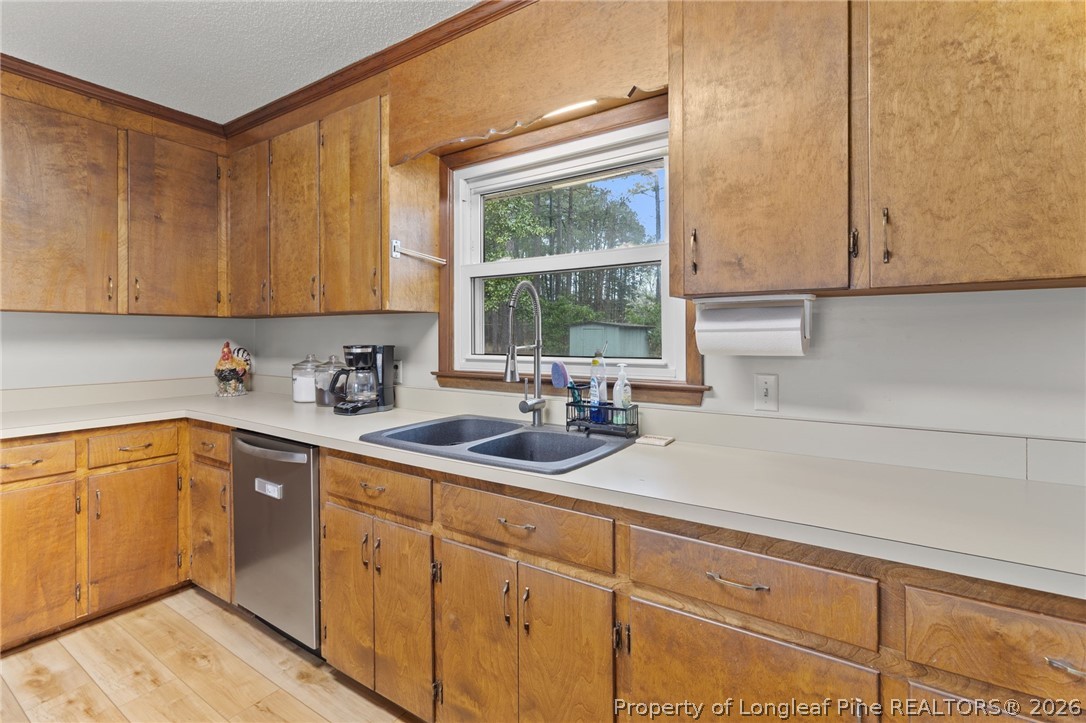 730 Slocomb Road Fayetteville, NC 28311 - Photo 16 of 48 a kitchen with sink cabinets and window