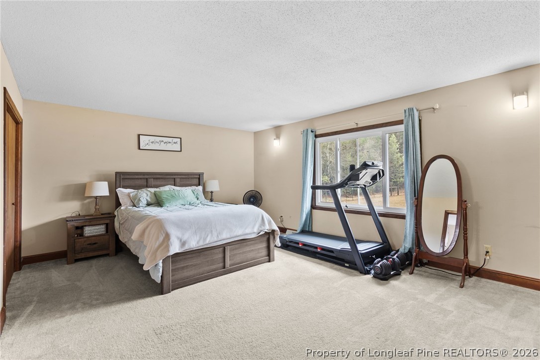 730 Slocomb Road Fayetteville, NC 28311 - Photo 21 of 48 a bedroom with a bed and a window