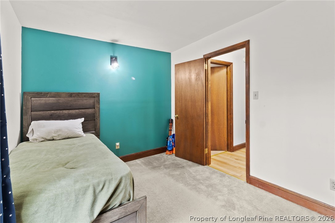 730 Slocomb Road Fayetteville, NC 28311 - Photo 27 of 48 a bedroom with a bed and a window