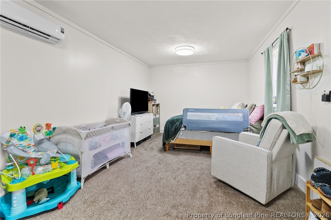 730 Slocomb Road Fayetteville, NC 28311 - Photo 38 of 48 a living room with furniture and a wooden floor