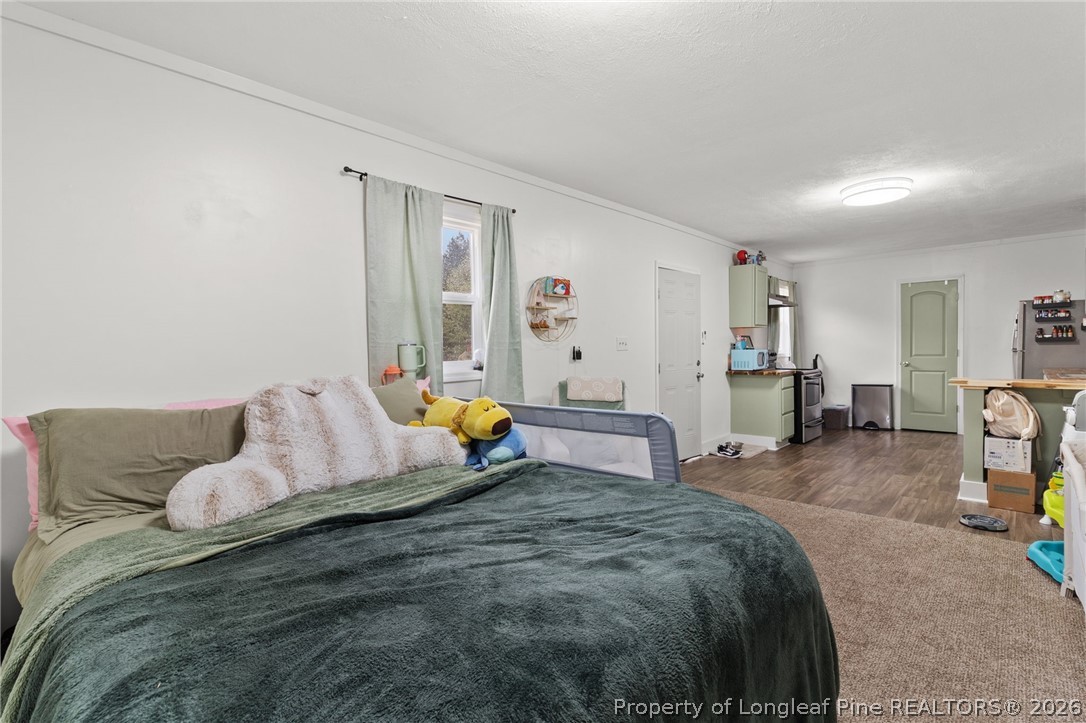 730 Slocomb Road Fayetteville, NC 28311 - Photo 39 of 48 a bed room with a bed and a couch