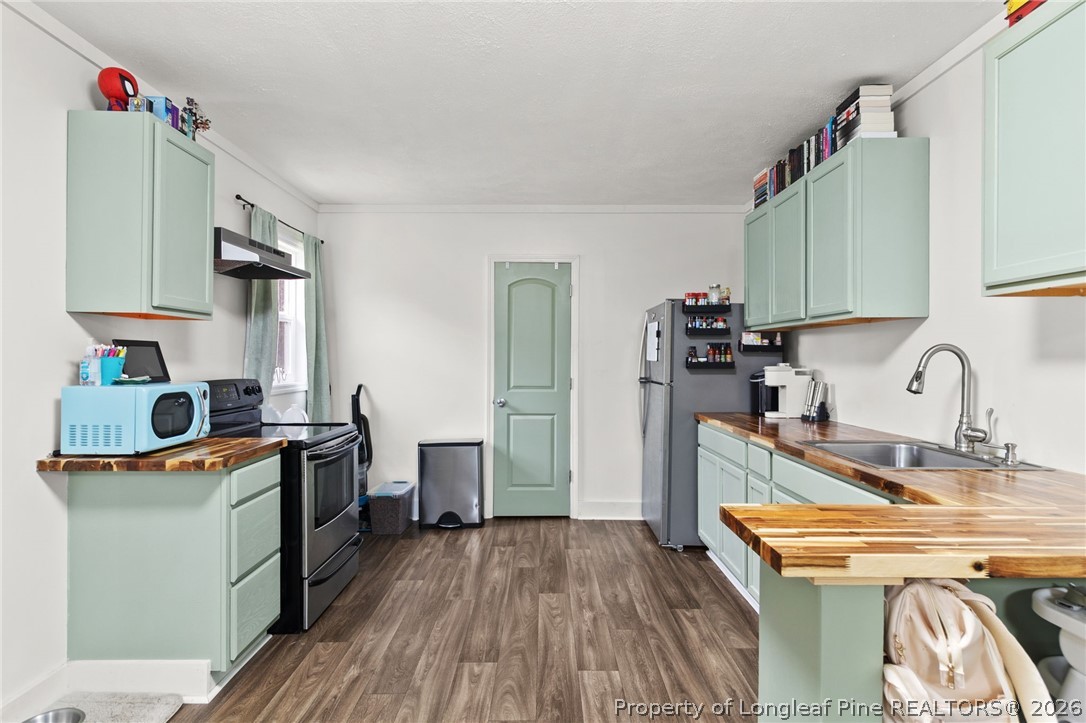 730 Slocomb Road Fayetteville, NC 28311 - Photo 40 of 48 a kitchen with stainless steel appliances granite countertop a sink stove and refrigerator