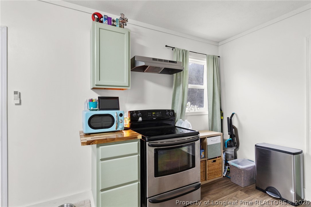 730 Slocomb Road Fayetteville, NC 28311 - Photo 41 of 48 a kitchen with a stove and a microwave