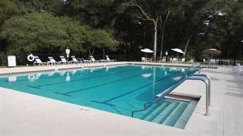 a view of a swimming pool with a patio