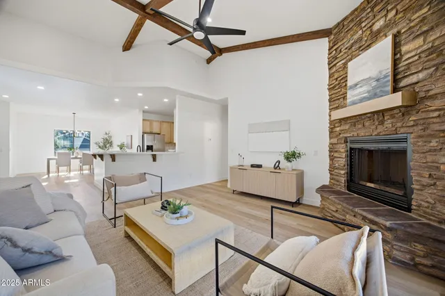 a living room with furniture and a fireplace