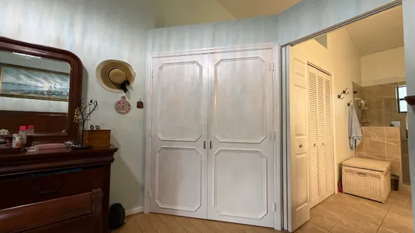 a bathroom with a sink vanity mirror and toilet