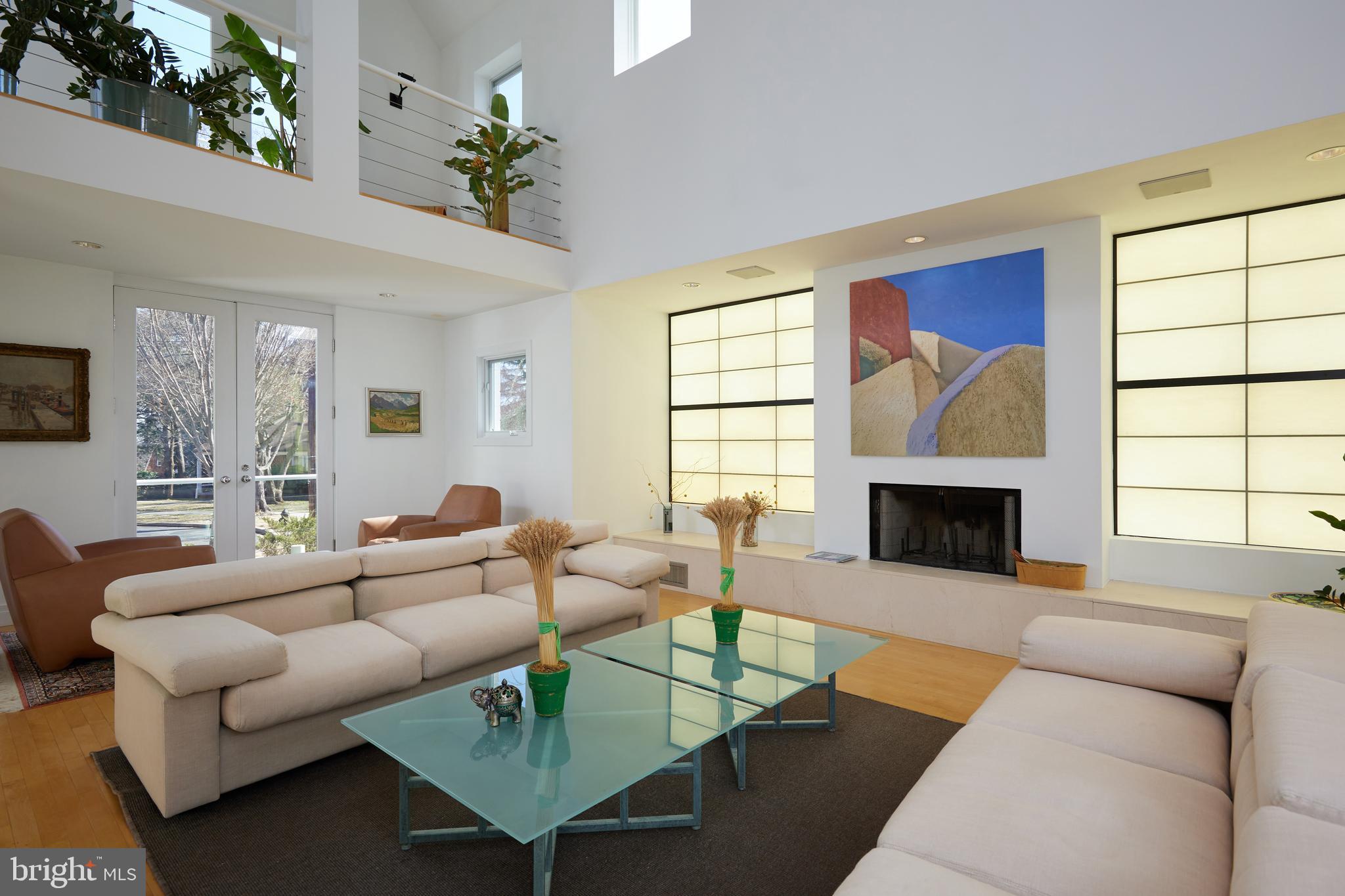 4527 Q Place Northwest Washington, DC 20007 - Photo 13 of 59 a living room with furniture a fireplace and a large window