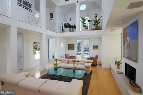 a living room with furniture fireplace and flat screen tv
