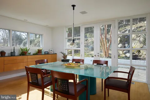 a view of a dining room with furniture window and outside view