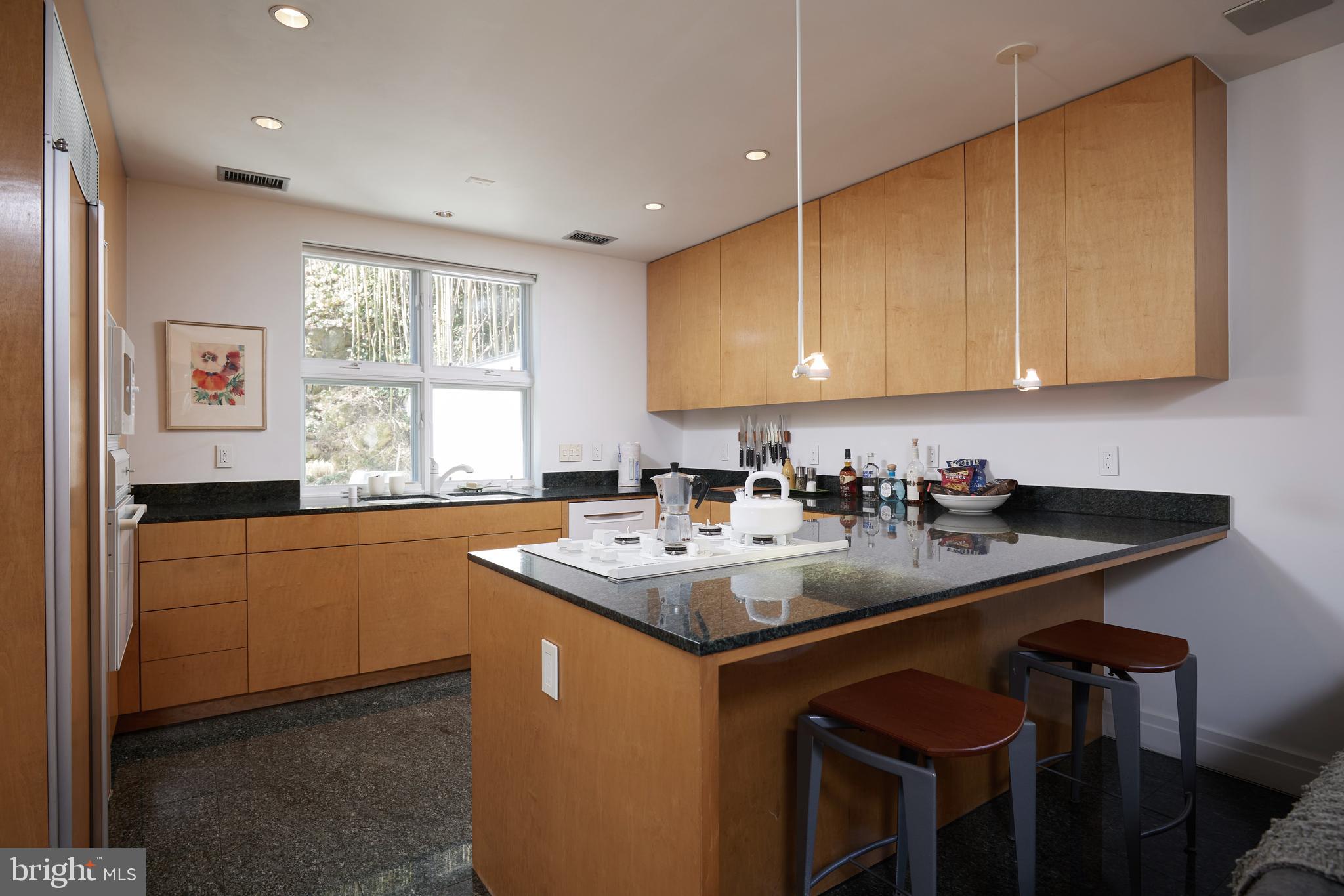 4527 Q Place Northwest Washington, DC 20007 - Photo 27 of 59 a kitchen with a sink cabinets and window