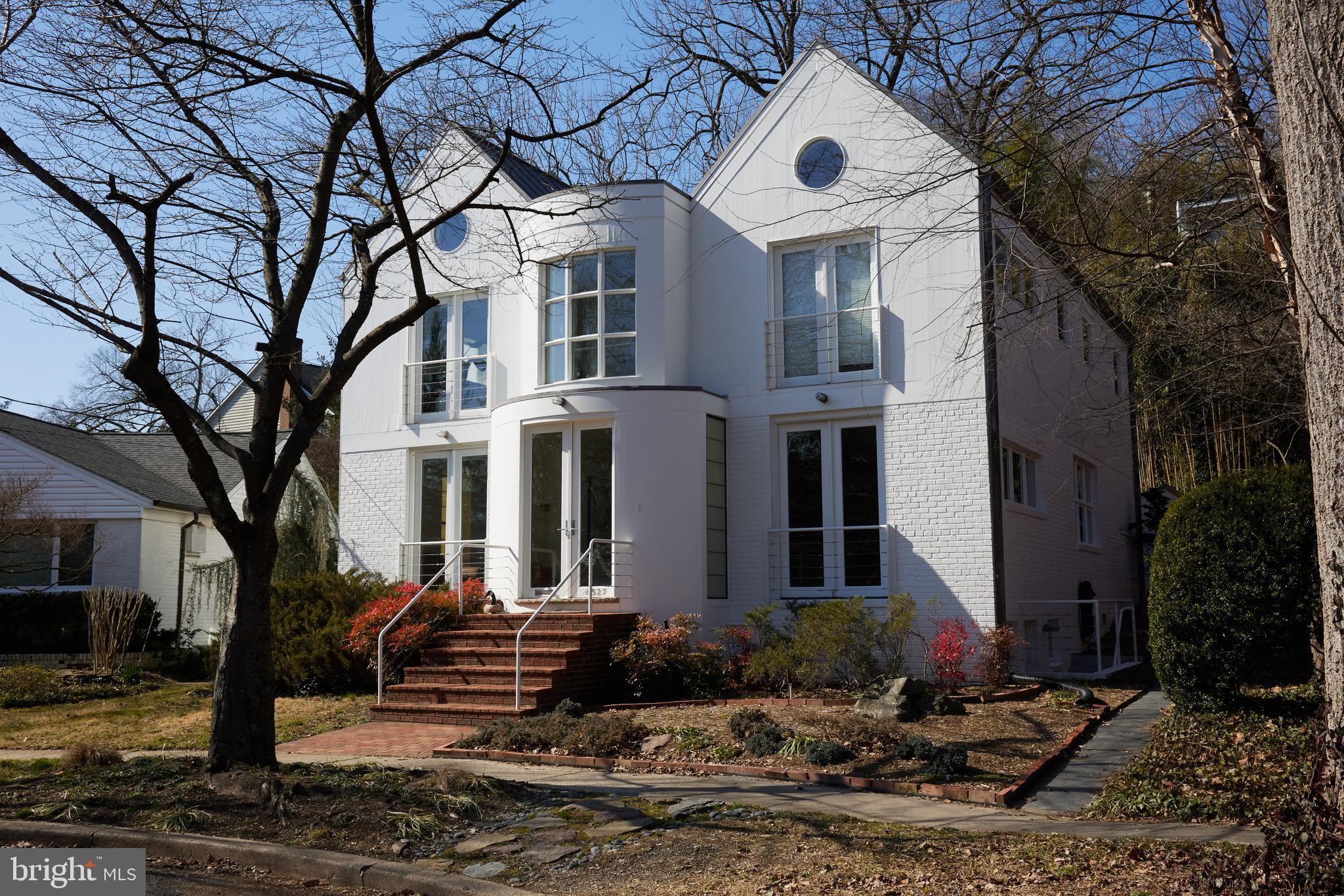 4527 Q Place Northwest Washington, DC 20007 - Photo 3 of 59 a front view of a house with a yard