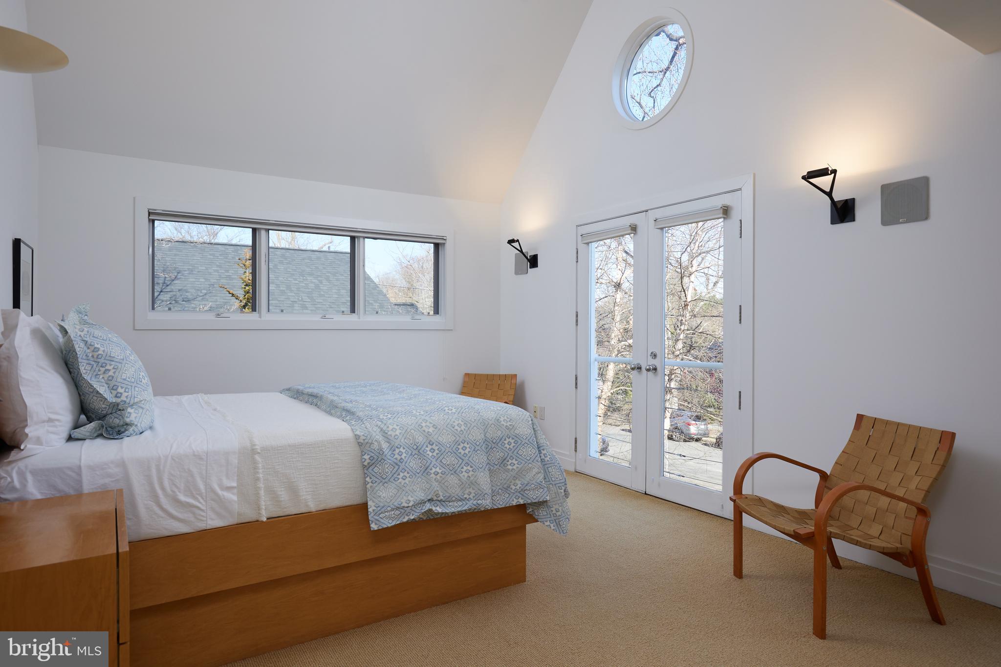 4527 Q Place Northwest Washington, DC 20007 - Photo 35 of 59 a bedroom with a bed chair and two windows