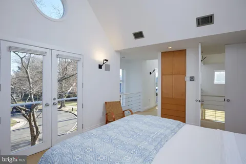 a view of a livingroom with furniture and natural light
